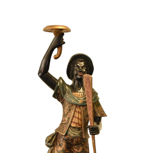 325 - A pair of reproduction painted wood blackamoor figural torchere Each modelled standing atop gondola ... 