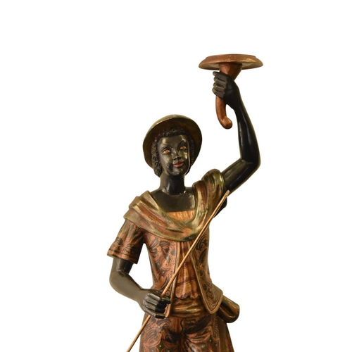 325 - A pair of reproduction painted wood blackamoor figural torchere Each modelled standing atop gondola ... 