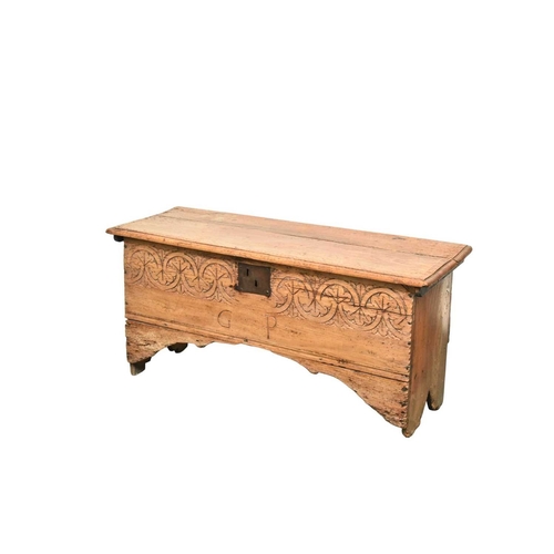 353 - A 17th century carved elm six plank coffer The moulded top with tooled frieze, the front with guillo... 