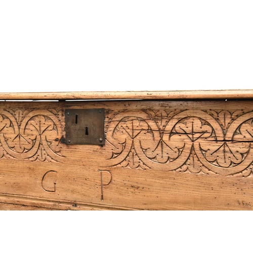 353 - A 17th century carved elm six plank coffer The moulded top with tooled frieze, the front with guillo... 