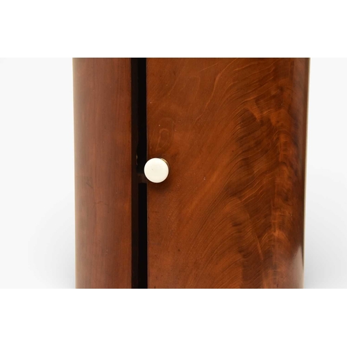 366 - A George III mahogany marble inset drum pot cupboard The molded top over a single door opening onto ... 