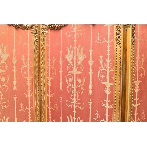 387 - A French giltwood Empire style three-fold room screen Late 19th century, each panel with moulded fra... 