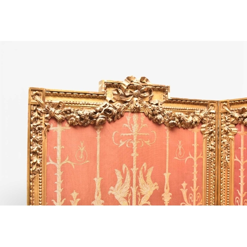 387 - A French giltwood Empire style three-fold room screen Late 19th century, each panel with moulded fra... 