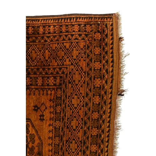 398 - An Afghan Bokkara pattern carpet First half 20th century The central ochre field with multiple 'elep... 