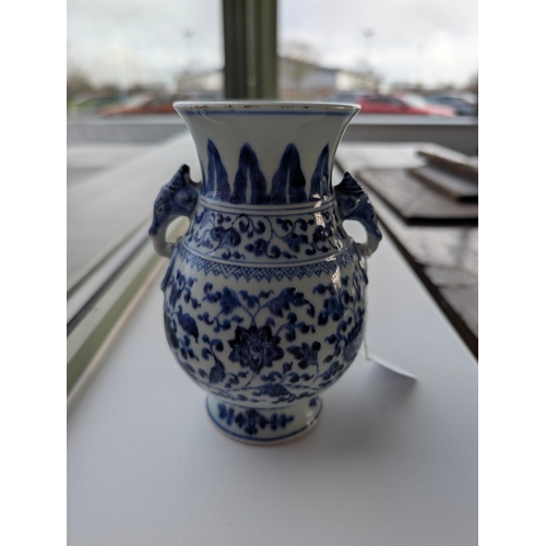 214 - A Chinese blue and white porcelain Hu-form vase 18th century, probably Qianlong Of ovoid form with t... 