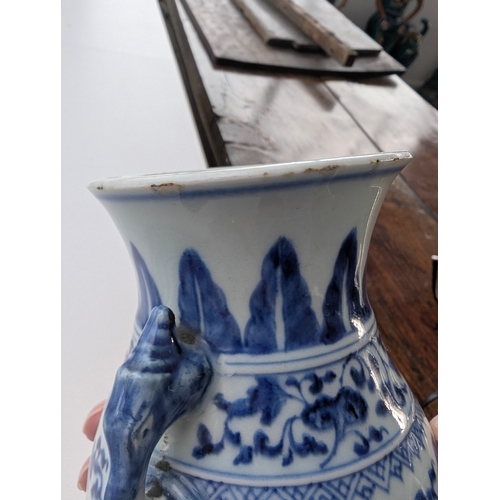 214 - A Chinese blue and white porcelain Hu-form vase 18th century, probably Qianlong Of ovoid form with t... 
