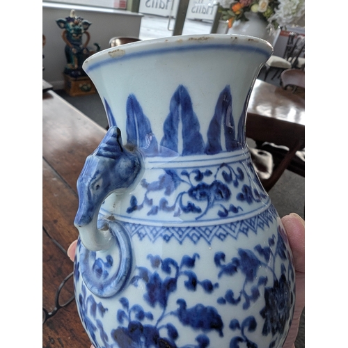 214 - A Chinese blue and white porcelain Hu-form vase 18th century, probably Qianlong Of ovoid form with t... 