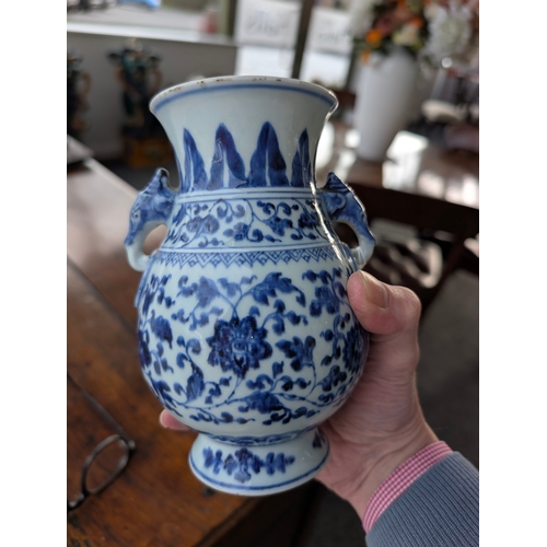 214 - A Chinese blue and white porcelain Hu-form vase 18th century, probably Qianlong Of ovoid form with t... 