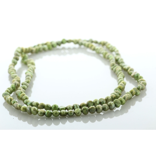 134 - 5.0 - 5.5mm baroque shaped green pearl necklace.
Pearl quality AAA. This necklace is 36 inches long.... 