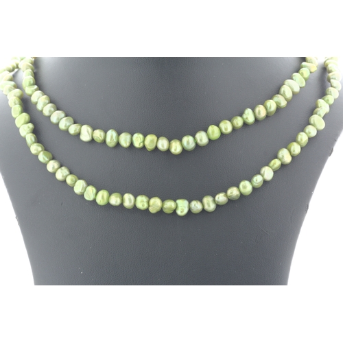 134 - 5.0 - 5.5mm baroque shaped green pearl necklace.
Pearl quality AAA. This necklace is 36 inches long.... 