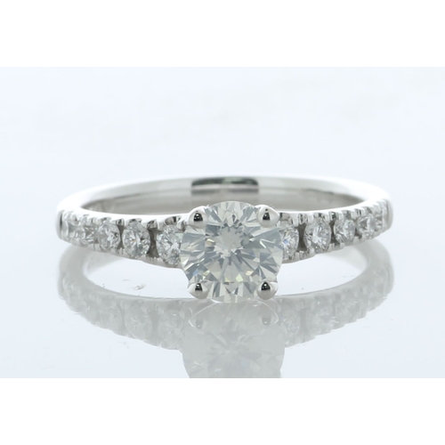 17 - A modern classic style diamond engagement ring with a lively natural round brilliant cut diamond 0.7... 