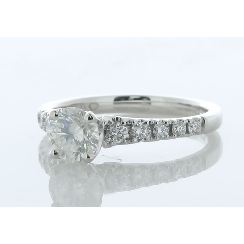 17 - A modern classic style diamond engagement ring with a lively natural round brilliant cut diamond 0.7... 