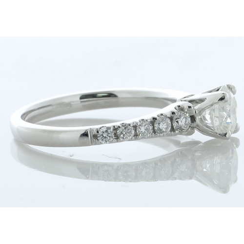 17 - A modern classic style diamond engagement ring with a lively natural round brilliant cut diamond 0.7... 