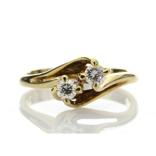 2 - Two round brilliant cut diamonds 0.47 carats are set in this gorgeous 18ct yellow gold crossover rin... 