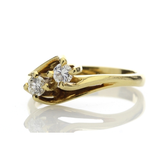 2 - Two round brilliant cut diamonds 0.47 carats are set in this gorgeous 18ct yellow gold crossover rin... 