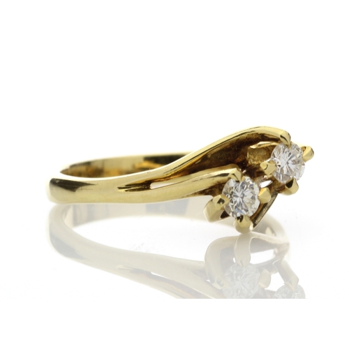 2 - Two round brilliant cut diamonds 0.47 carats are set in this gorgeous 18ct yellow gold crossover rin... 