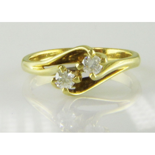 2 - Two round brilliant cut diamonds 0.47 carats are set in this gorgeous 18ct yellow gold crossover rin... 