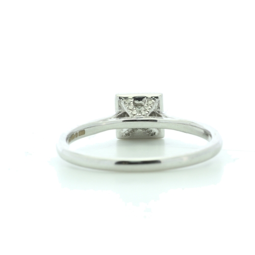 21 - A sparkling natural princess cut diamond is surrounded by a halo of sixteen round brilliant cut diam... 