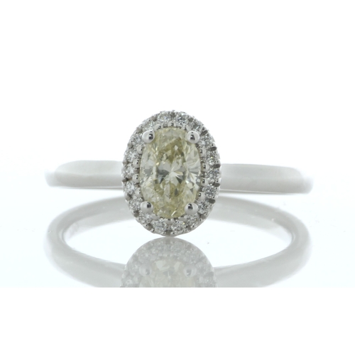 25 - A gorgeous natural oval diamond is surrounded by a halo of eighteen round brilliant cut diamonds to ... 