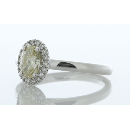 25 - A gorgeous natural oval diamond is surrounded by a halo of eighteen round brilliant cut diamonds to ... 