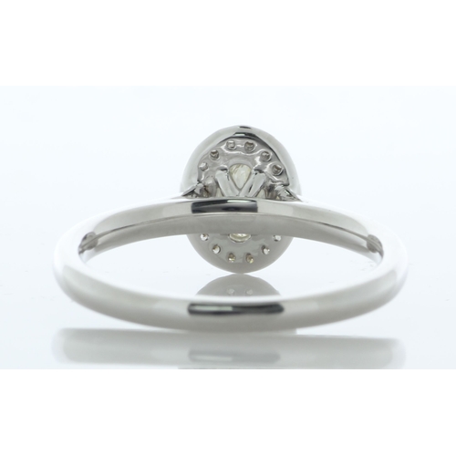 25 - A gorgeous natural oval diamond is surrounded by a halo of eighteen round brilliant cut diamonds to ... 