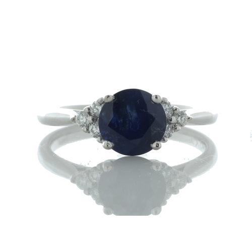 26 - A stunning oval sapphire weighing 1.83 carats sits between six round brilliant cut diamonds on the s... 