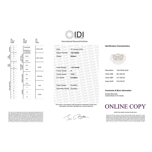 27 - One natural round brilliant cut diamond 0.75 carats is set between two round variation diamonds, eac... 