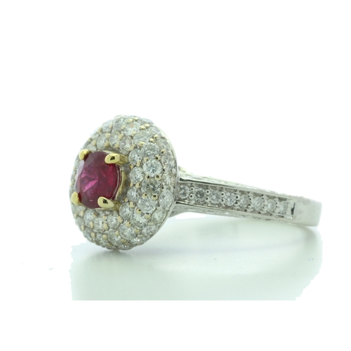 34 - A gorgeous ruby is nestled in a triple halo of sixty two diamonds and fifty eight diamonds on the in... 