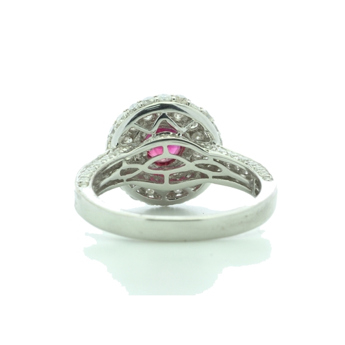 34 - A gorgeous ruby is nestled in a triple halo of sixty two diamonds and fifty eight diamonds on the in... 