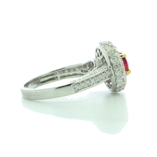 34 - A gorgeous ruby is nestled in a triple halo of sixty two diamonds and fifty eight diamonds on the in... 