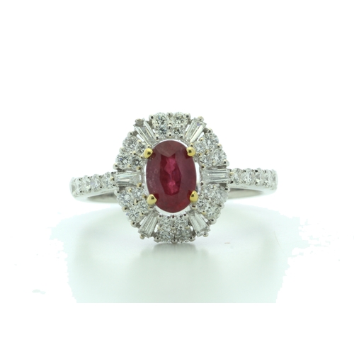 35 - A stunning oval ruby is surrounded by baguette cut diamonds and round brilliant cut diamonds on the ... 