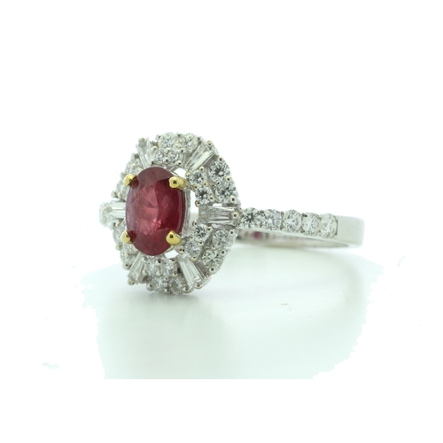 35 - A stunning oval ruby is surrounded by baguette cut diamonds and round brilliant cut diamonds on the ... 