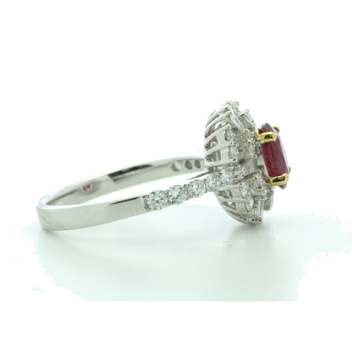 35 - A stunning oval ruby is surrounded by baguette cut diamonds and round brilliant cut diamonds on the ... 