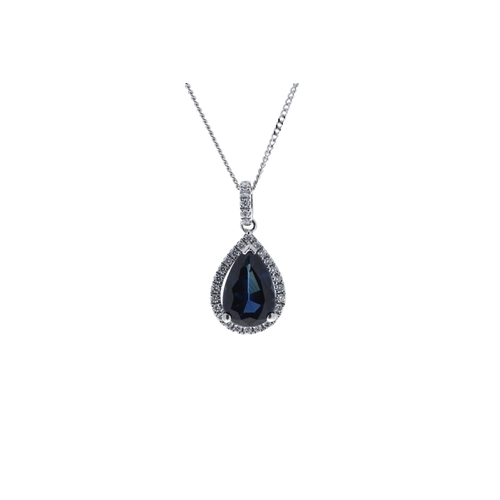 38 - A gorgeous pear shaped sapphire sits in a halo of diamonds with a diamond set bale. This stunning 18... 