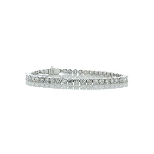 40 - Thirty seven round brilliant cut diamonds are set in this 18ct white gold diamond tennis bracelet. I... 