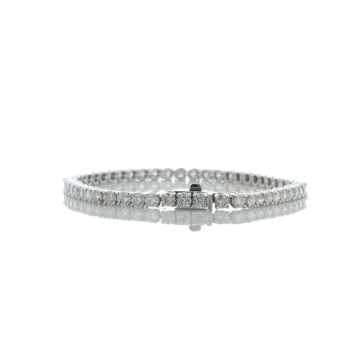 40 - Thirty seven round brilliant cut diamonds are set in this 18ct white gold diamond tennis bracelet. I... 