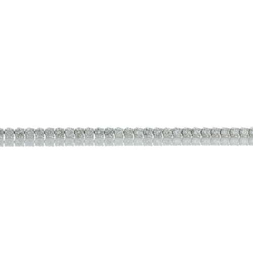 40 - Thirty seven round brilliant cut diamonds are set in this 18ct white gold diamond tennis bracelet. I... 