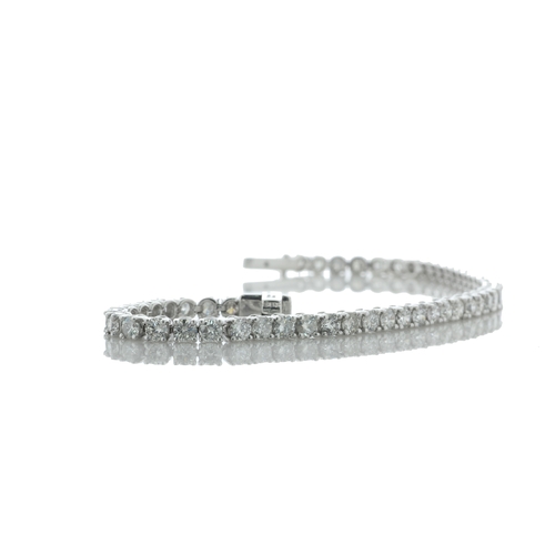 40 - Thirty seven round brilliant cut diamonds are set in this 18ct white gold diamond tennis bracelet. I... 