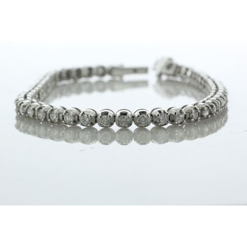 41 - Fifty one round brilliant cut diamonds are set in this stunning 18ct white gold tennis style bracele... 