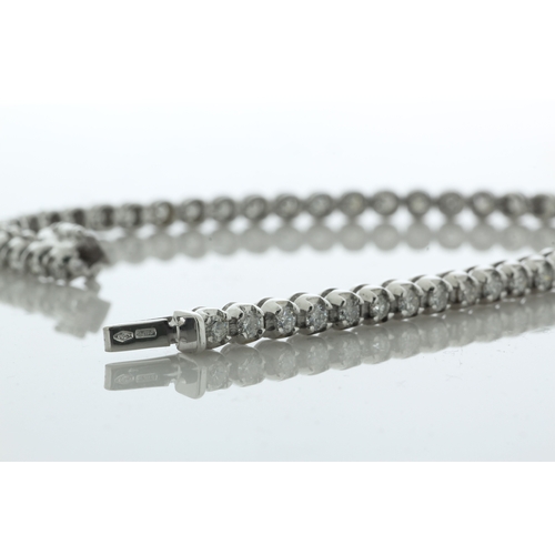 41 - Fifty one round brilliant cut diamonds are set in this stunning 18ct white gold tennis style bracele... 