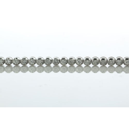 41 - Fifty one round brilliant cut diamonds are set in this stunning 18ct white gold tennis style bracele... 