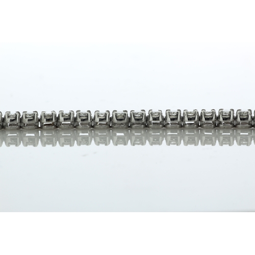 41 - Fifty one round brilliant cut diamonds are set in this stunning 18ct white gold tennis style bracele... 