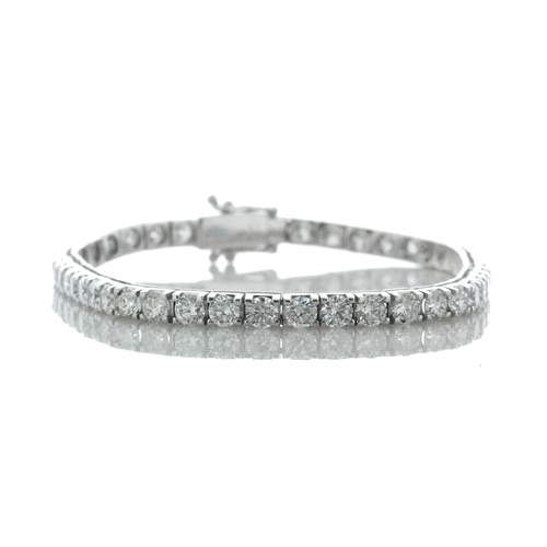 43 - Forty six round brilliant cut diamonds are set in this stunning box style tennis bracelet. 7 inches ... 