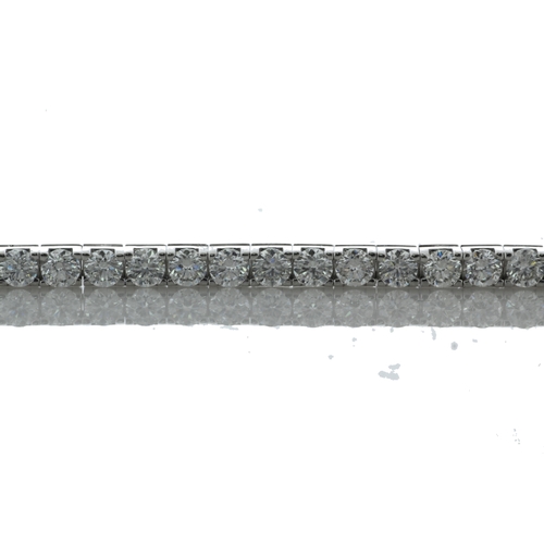 43 - Forty six round brilliant cut diamonds are set in this stunning box style tennis bracelet. 7 inches ... 