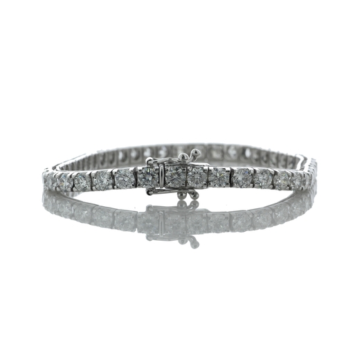 43 - Forty six round brilliant cut diamonds are set in this stunning box style tennis bracelet. 7 inches ... 