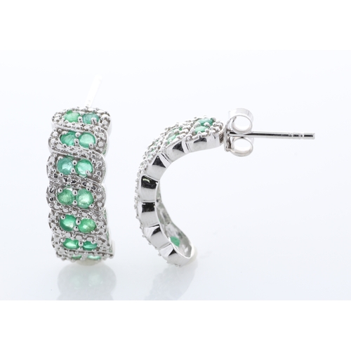 44 - Sterling silver emerald Earrings, set with twenty eight round emeralds. Item Specifications: Metal: ... 