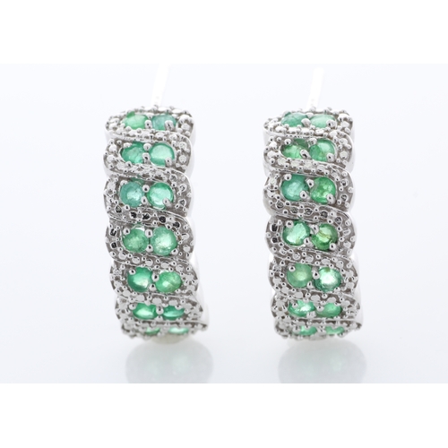 44 - Sterling silver emerald Earrings, set with twenty eight round emeralds. Item Specifications: Metal: ... 