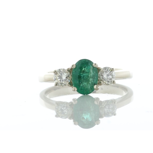 5 - A dazzling green oval emerald weighing 0.73 carats is set between two round brilliant cut diamonds. ... 