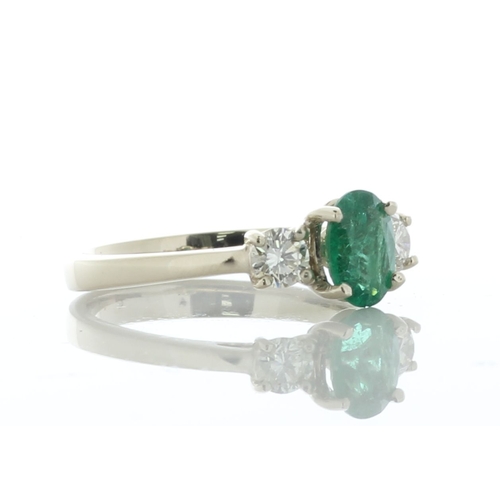 5 - A dazzling green oval emerald weighing 0.73 carats is set between two round brilliant cut diamonds. ... 