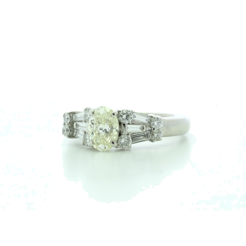 52 - One stunning natural oval cut diamond 0.70 carats set in an platinum engagement ring with a platinum... 